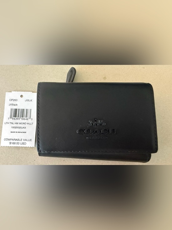 Coach Accessories - COACH Black Leather Tri-Fold Wallet with Embossed Coach Logo